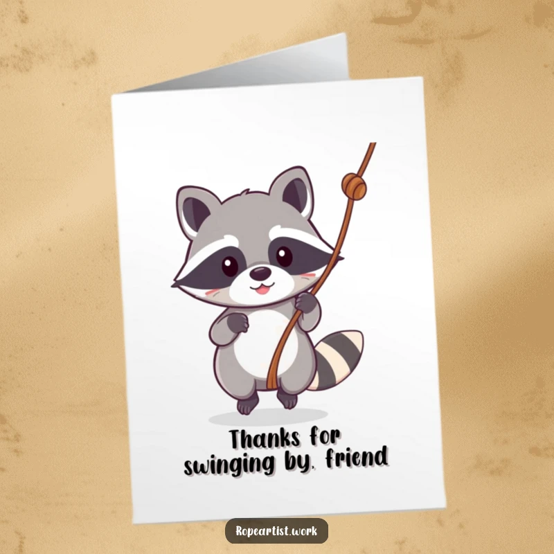 Funny free printable thank you card: Whimsical kawaii raccoon swinging on a rope, sending thanks with a cheerful vibe.