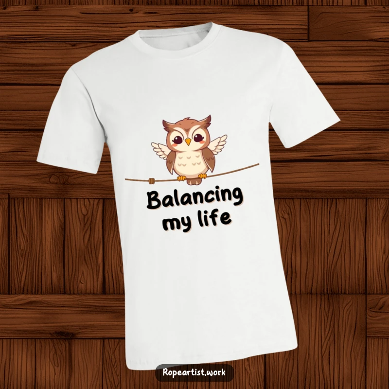 Funny owl t-shirt with a smiling character balancing expertly on a tightrope, a humorous and stylish choice.